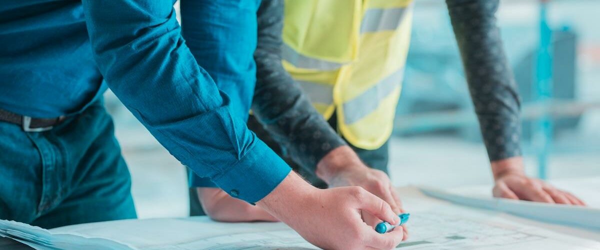 workers-checking-out-architectural-plan-project72